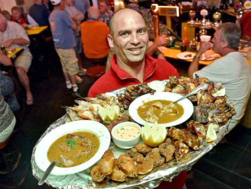 Signature Portuguese espetada skewer with rice and chips at Vasco Da Gama Taverna